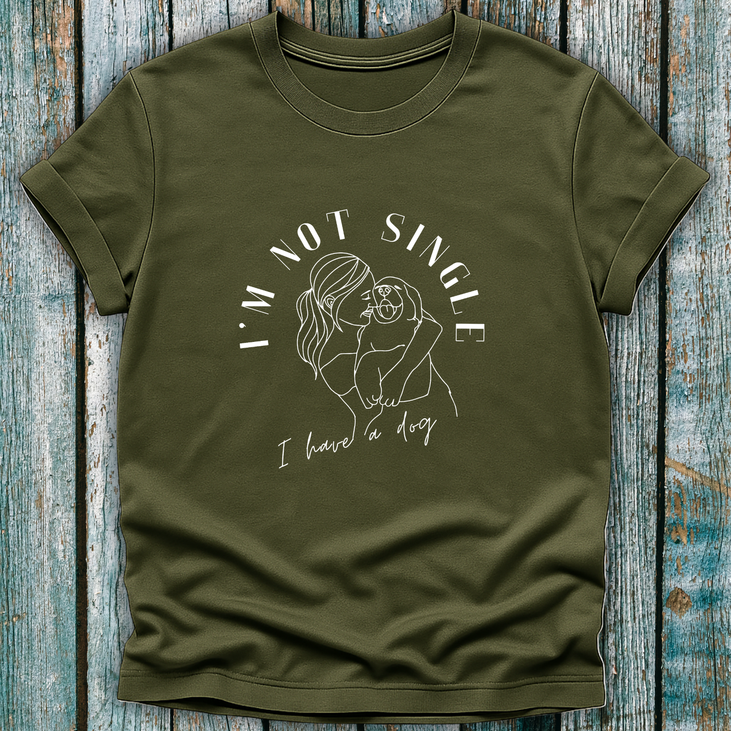 Green T-Shirt with I'm not single I have a dog and lady hugging a dog