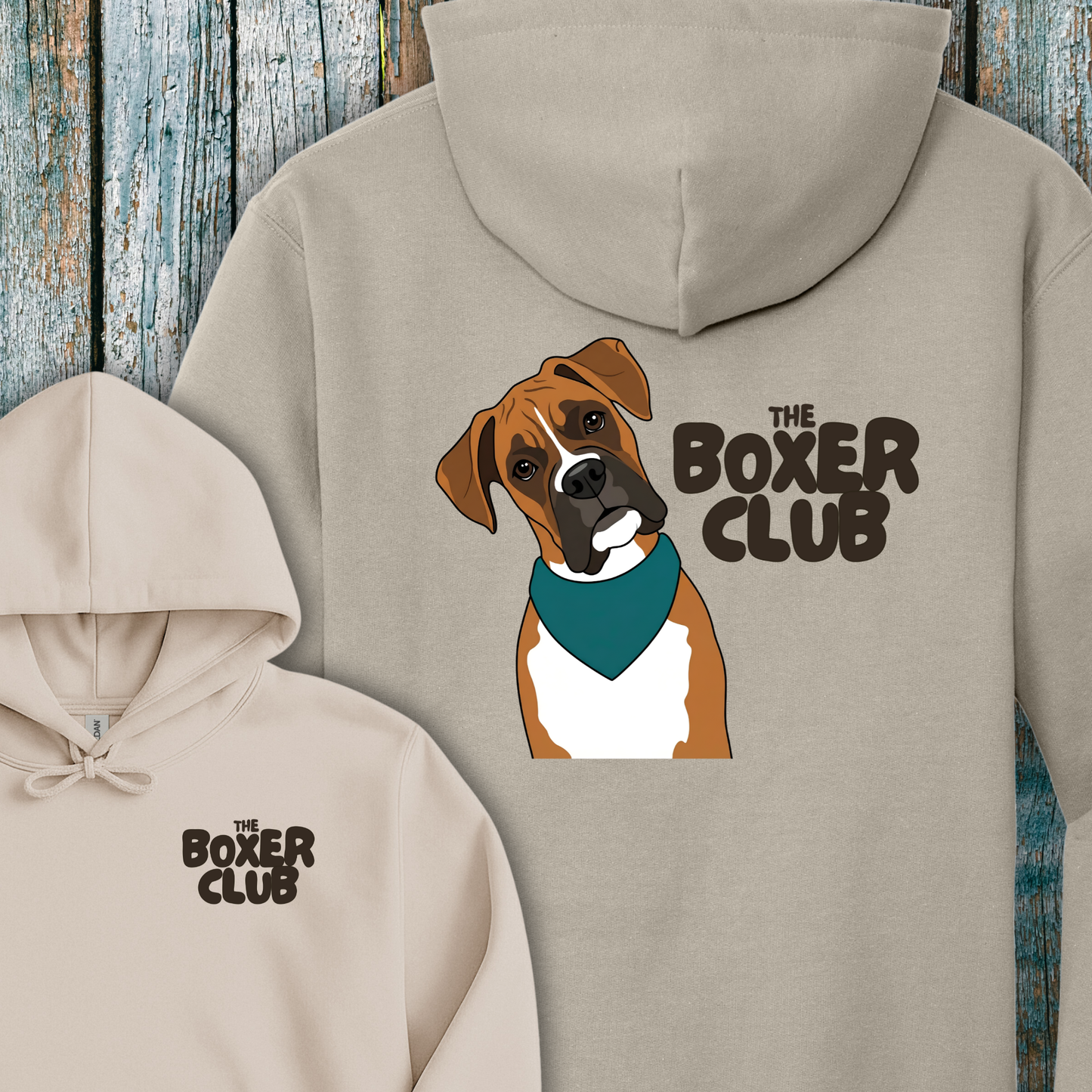 Beige hoodie with a boxer dog graphic and 'The Boxer Club' text on a wooden background