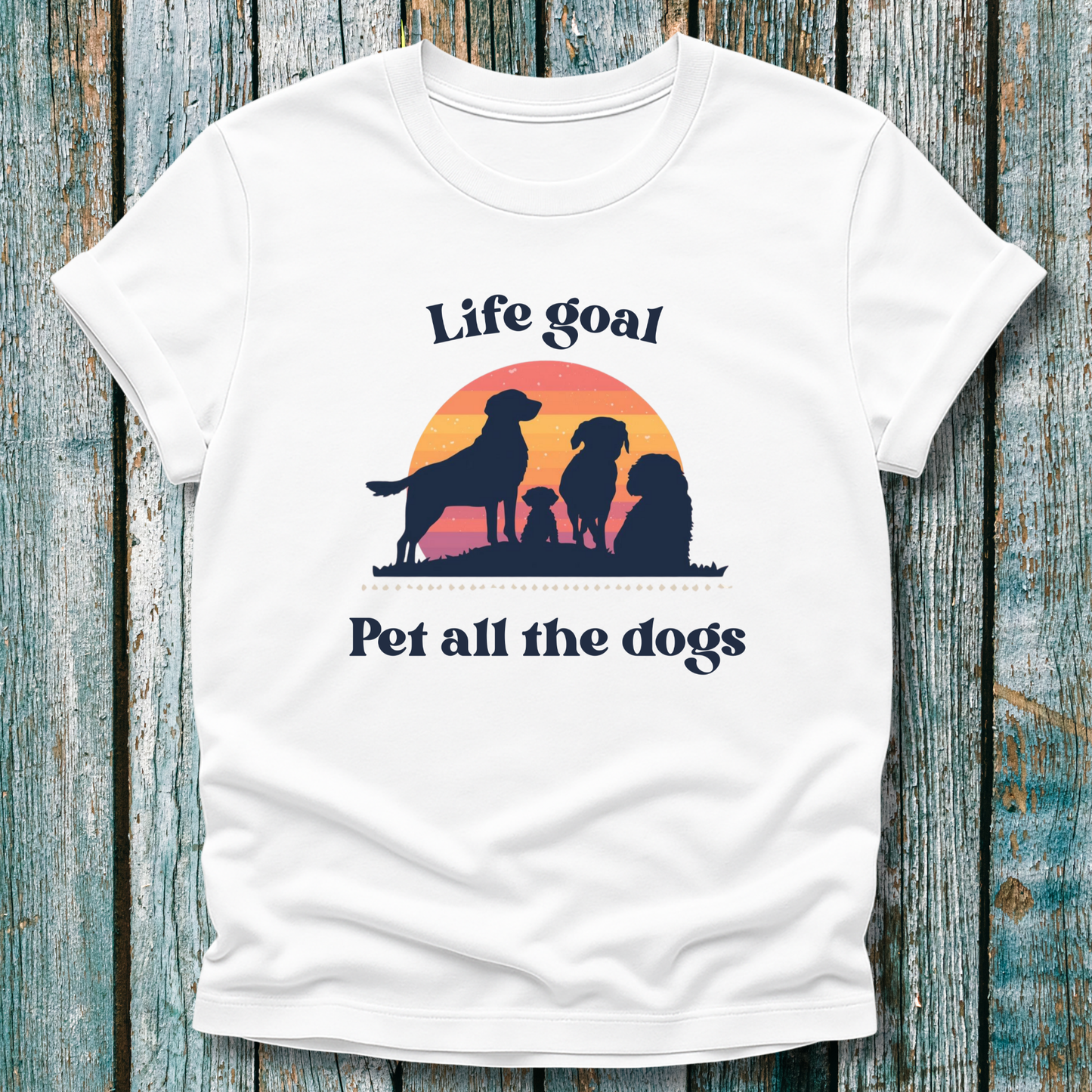 White Life Goal Pet all the Dogs t-shirt with silhouette of dogs in front of sunset 
