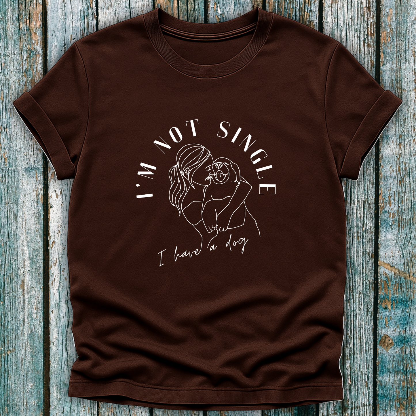 Brown T-Shirt with I'm not single I have a dog and lady hugging a dog