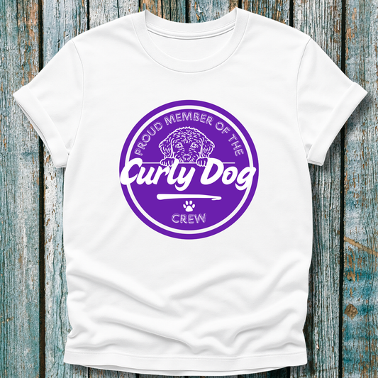 White t-shirt with purple graphic displaying proud member of the curly dog crew