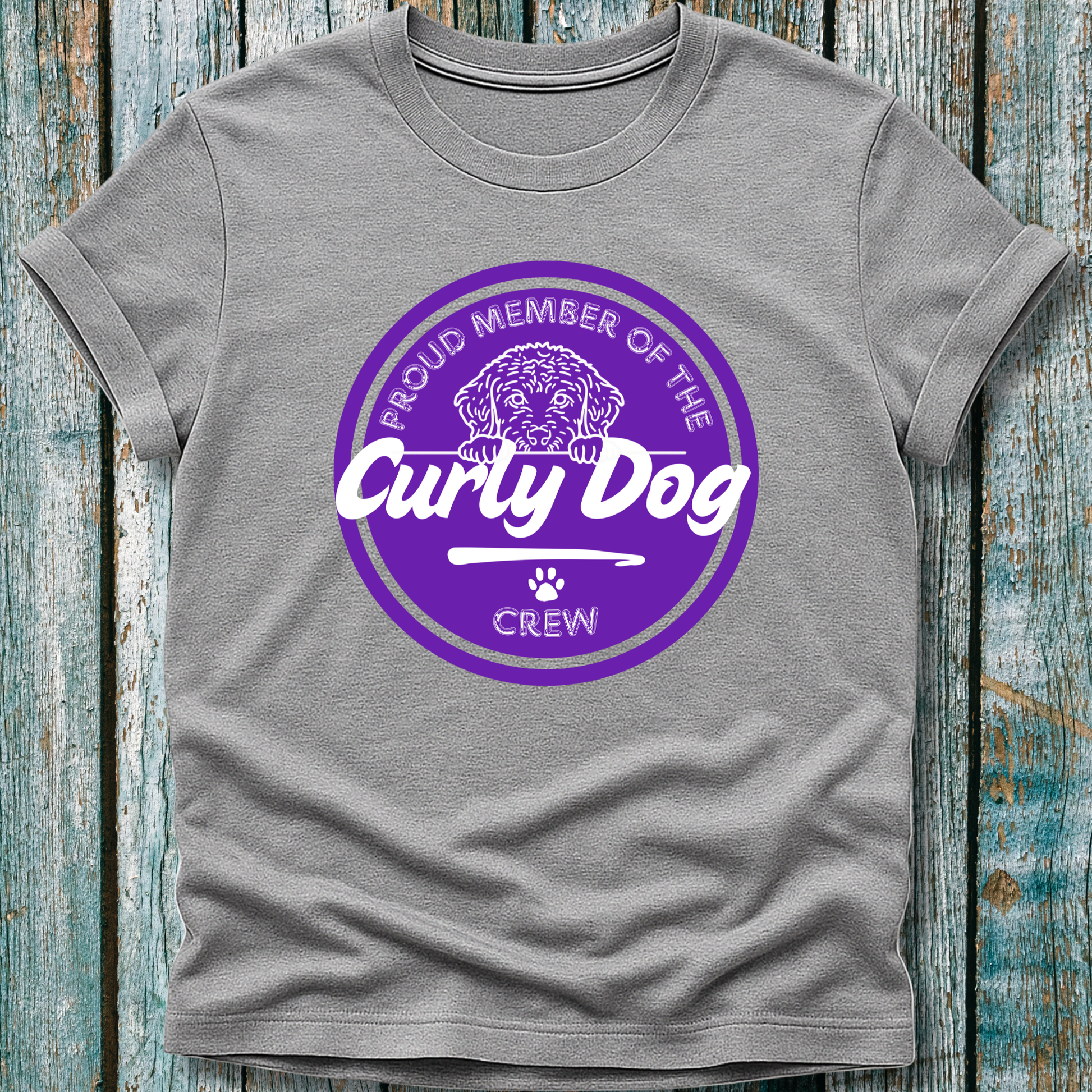 Grey t-shirt with purple graphic displaying proud member of the curly dog crew
