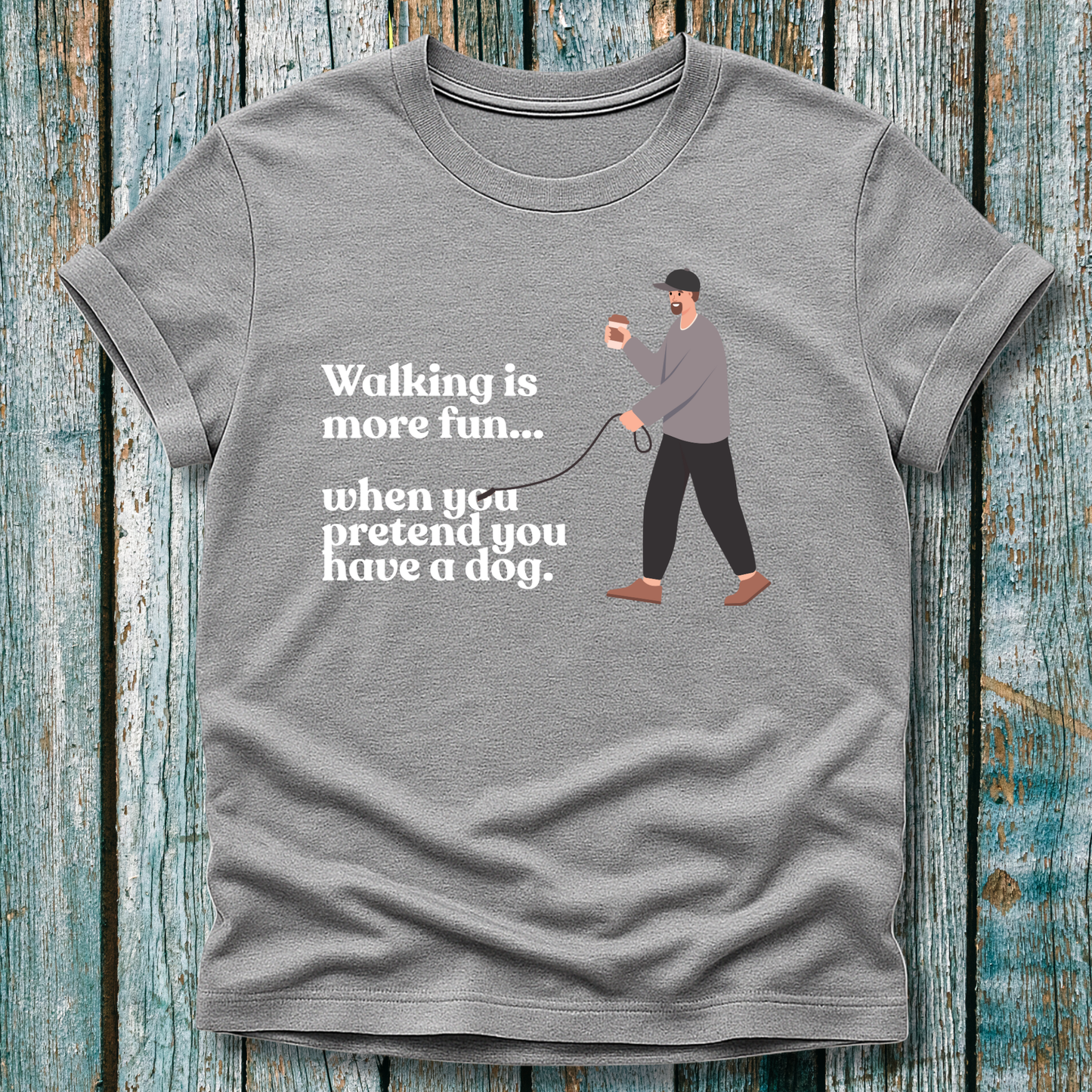 Grey T-Shirt with 'walking is more fun...when you pretend you have a dog' text and a lone man walking with a lead