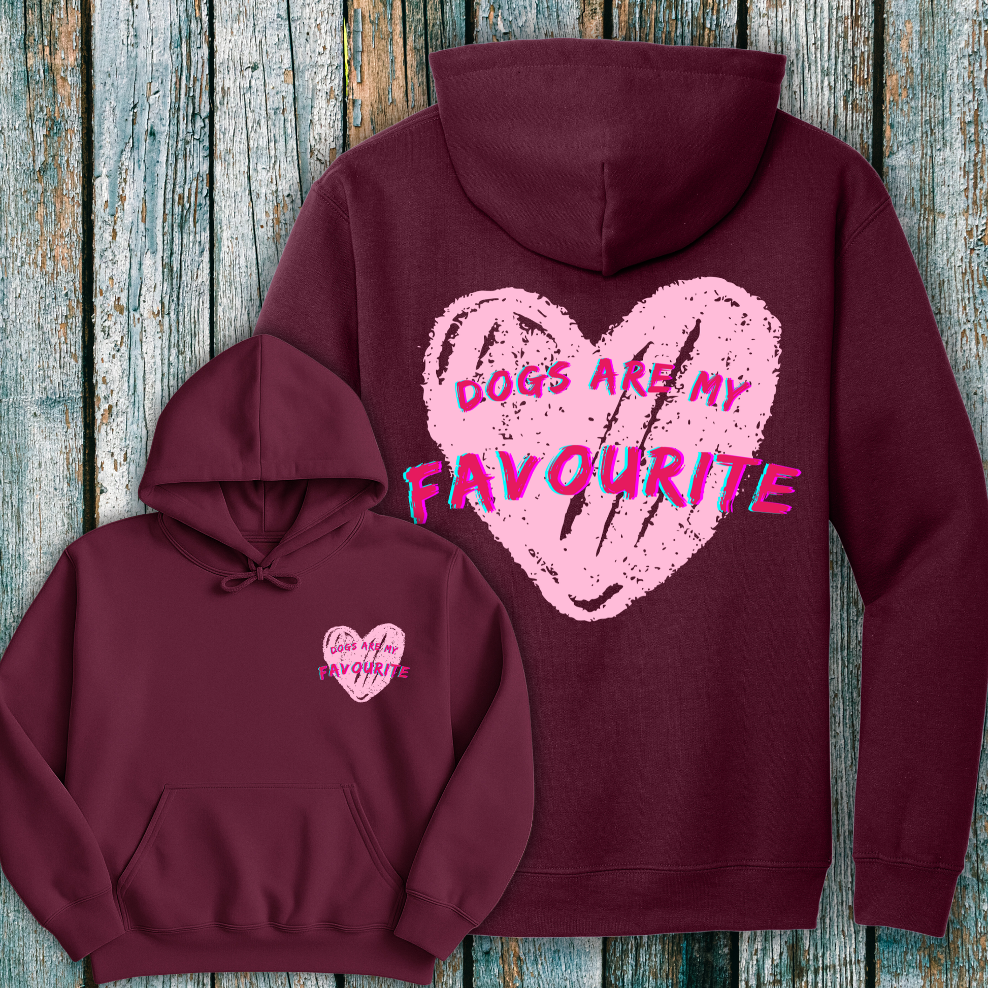 Maroon hoodie with pink heart and Dogs are my Favourite design and text on a wooden surface