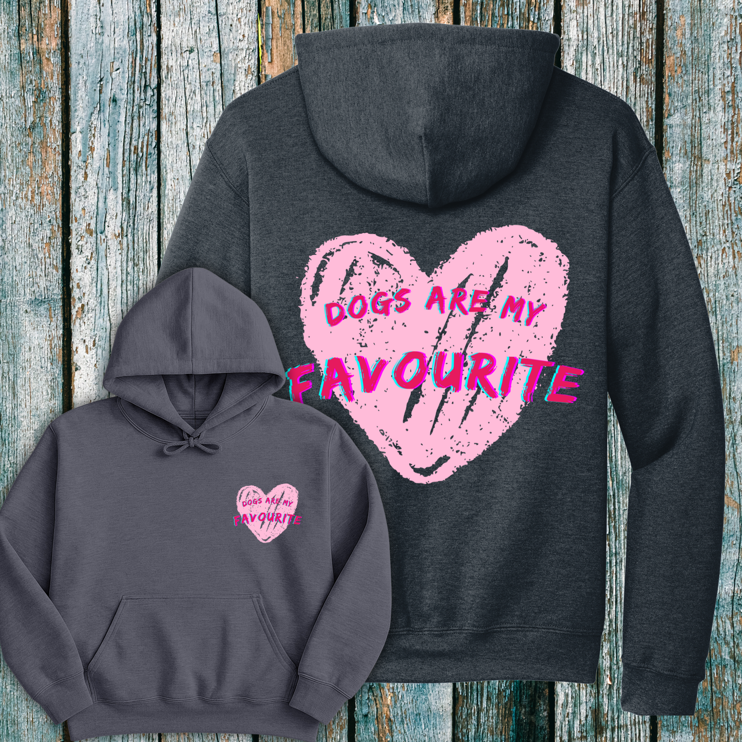 Dark grey hoodie with pink heart and Dogs are my Favourite design and text on a wooden surface