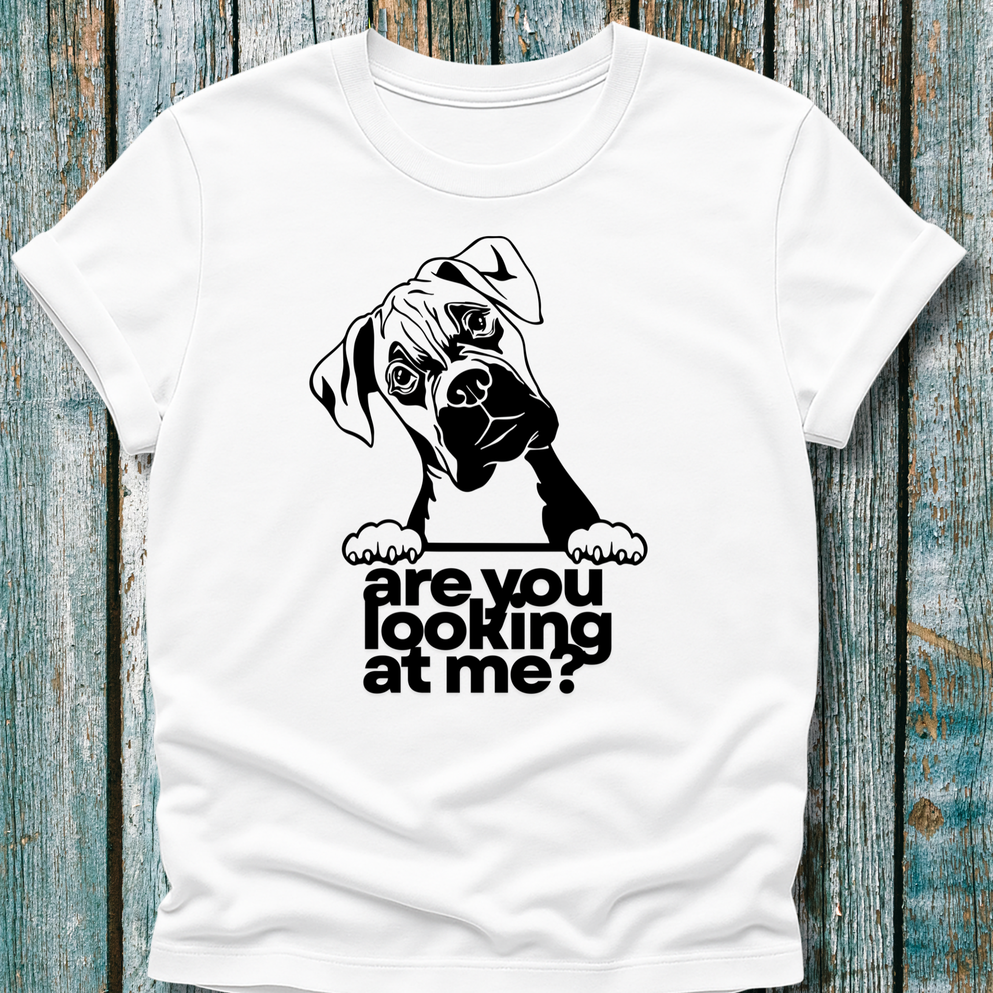 White t-shirt with a graphic of a boxer dog and text 'are you looking at me?' on a wooden surface.