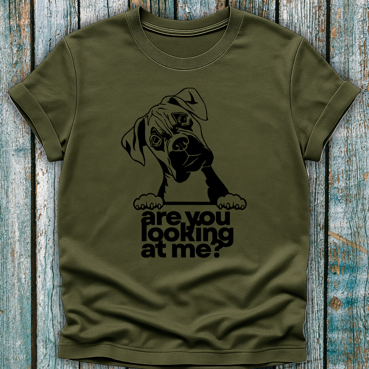Green t-shirt with a graphic of a boxer dog and text 'are you looking at me?' on a wooden surface.