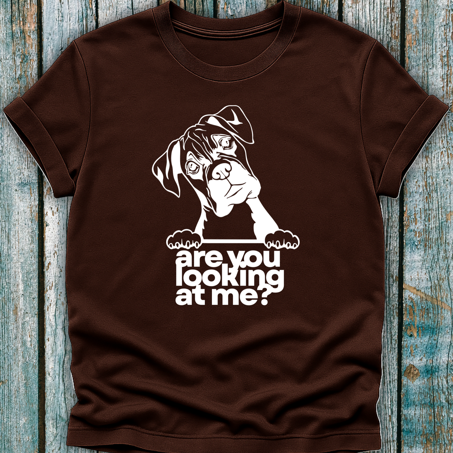Brown t-shirt with a graphic of a boxer dog and text 'are you looking at me?' on a wooden surface.