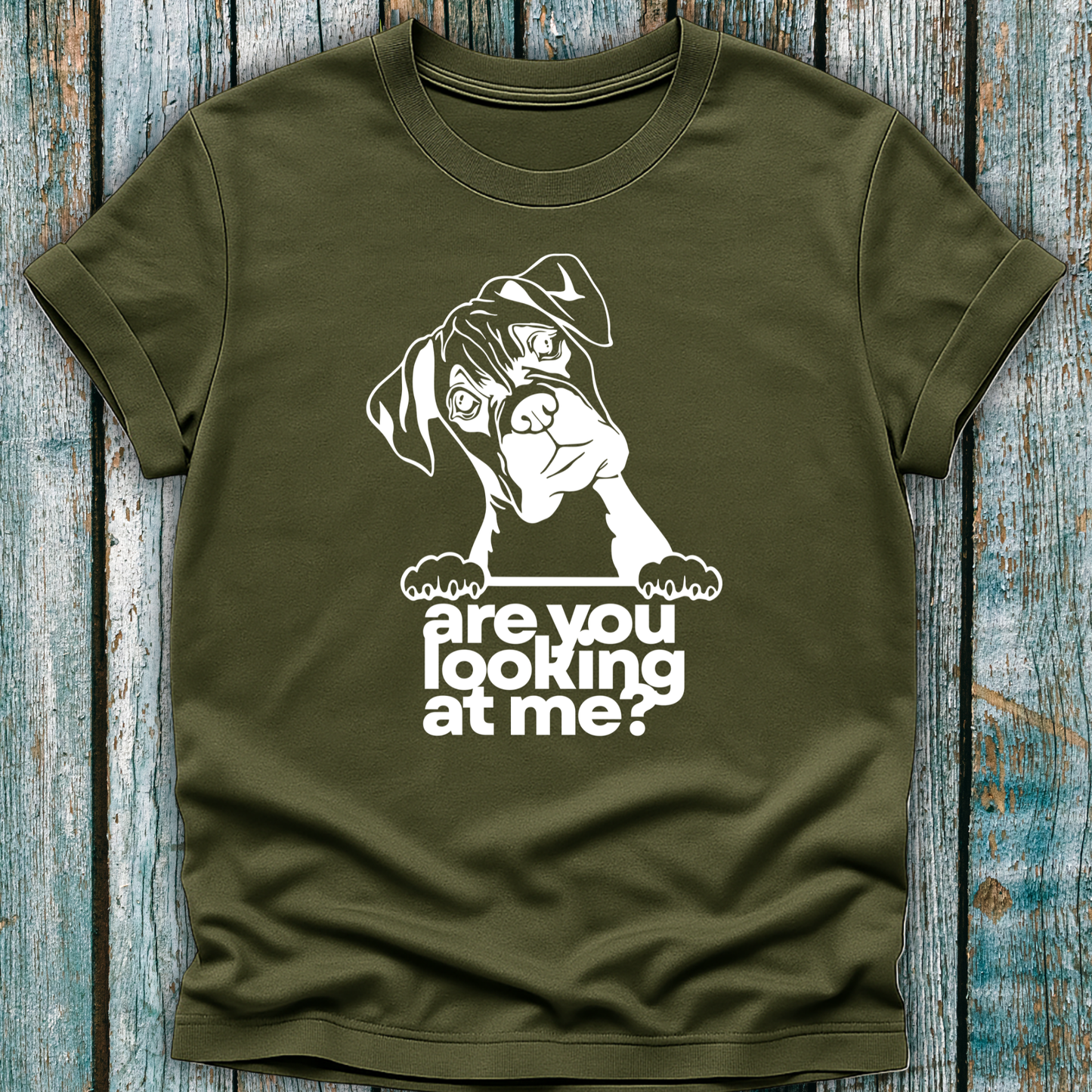 Green t-shirt with a graphic of a boxer dog and text 'are you looking at me?' on a wooden surface.