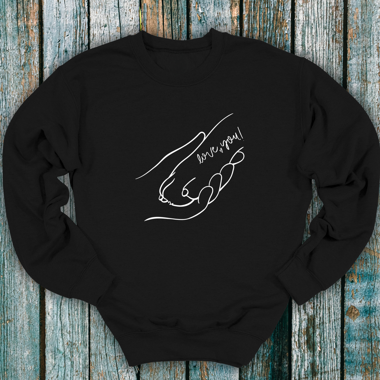 Black sweatshirt with hand holding a dog paw and 'I love you' message