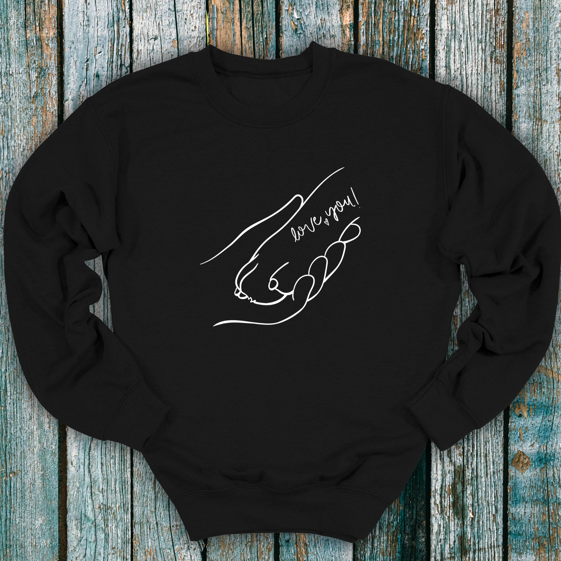 Black sweatshirt with hand holding a dog paw and 'I love you' message