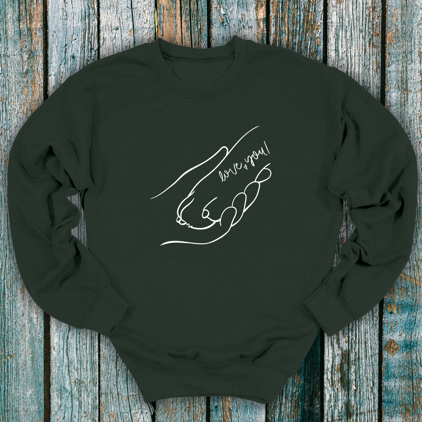 Green sweatshirt with hand holding a dog paw and 'I love you' message