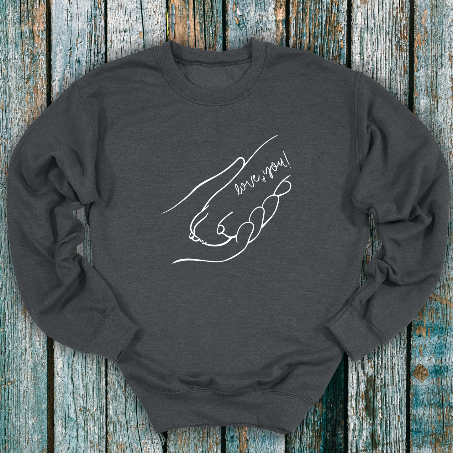 Gray sweatshirt with hand holding a dog paw and 'I love you' message