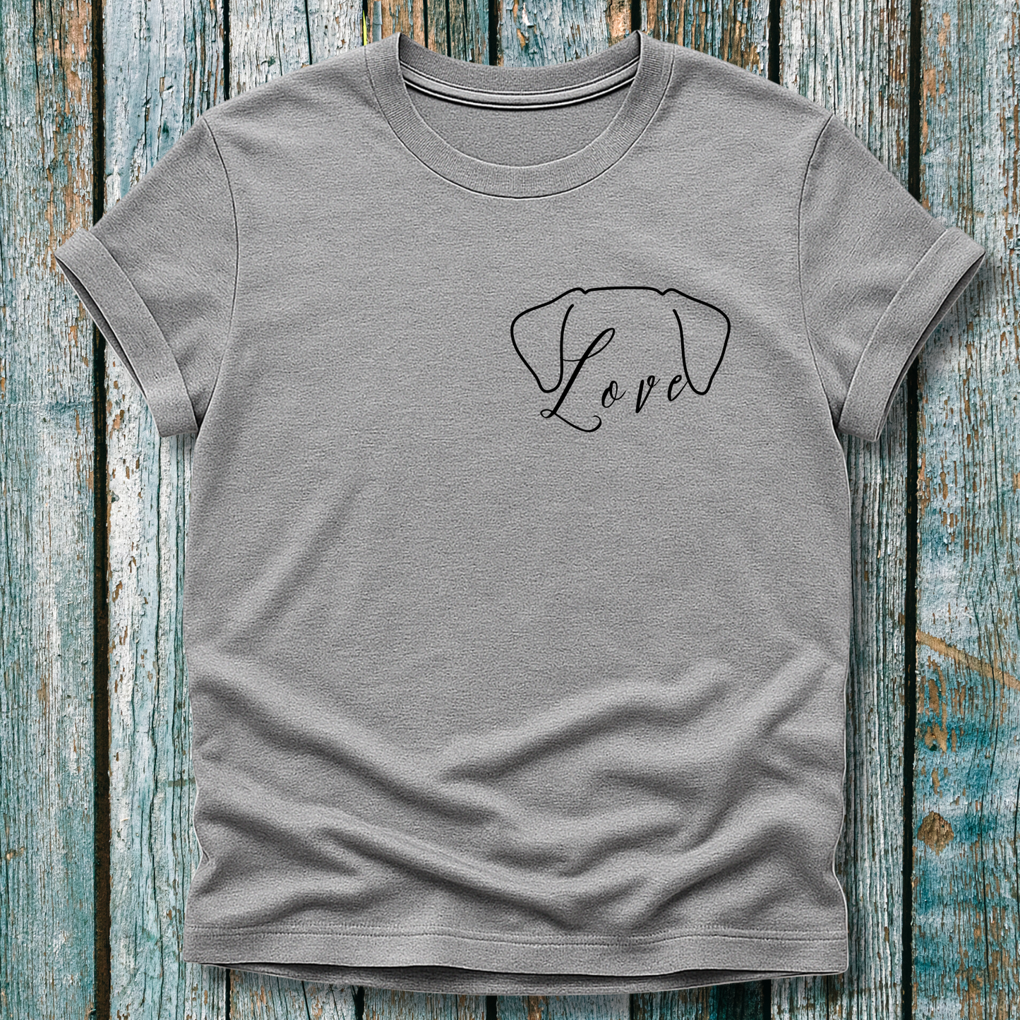 Gray t-shirt with 'Love' and dog ears design on a wooden surface
