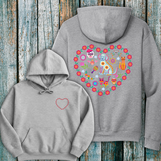 Gray hoodie with a colorful day of the dead inspired heart design on the front and back against a wooden background