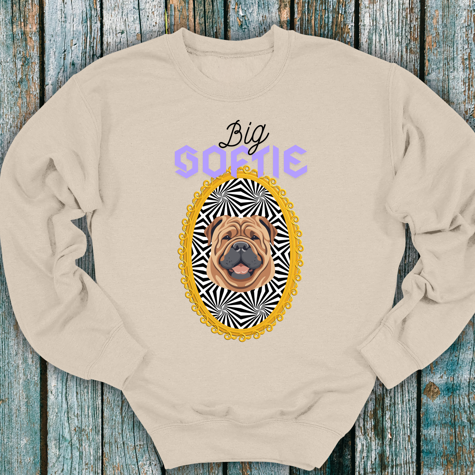 Beige sweatshirt with a Shar-Pei dog graphic and 'Big Softie' text on a wooden surface