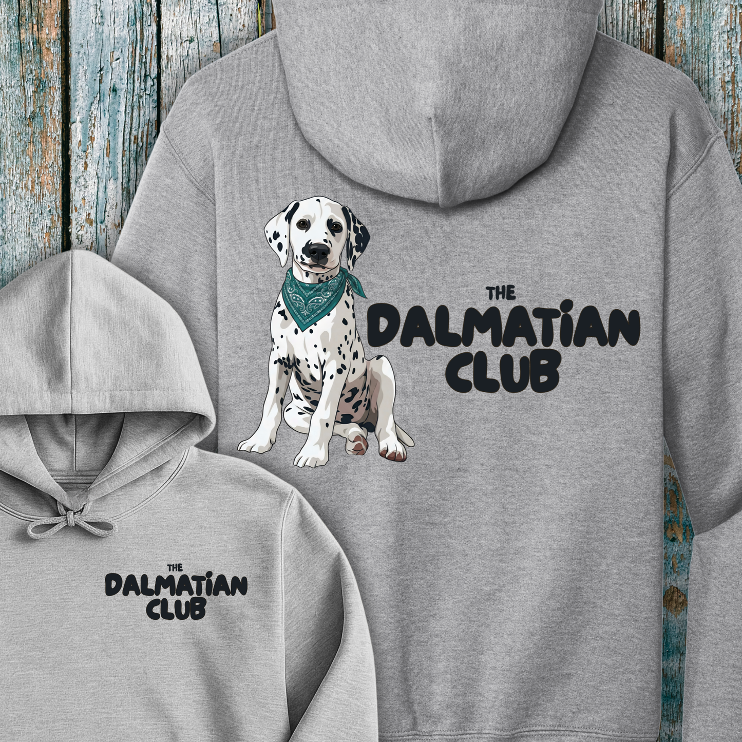 Gray hoodie with Dalmatian illustration and 'The Dalmatian Club' text on a wooden background