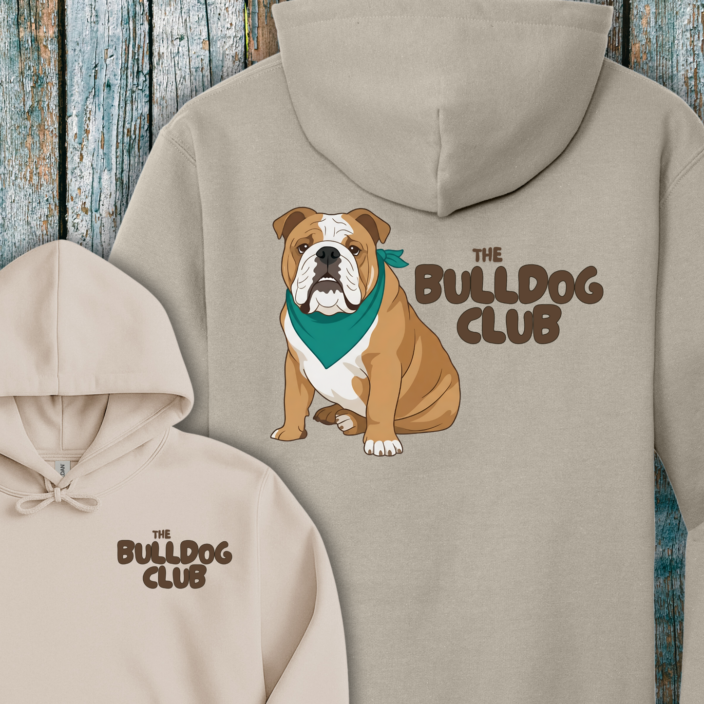 Beige hoodie with a bulldog and 'The Bulldog Club' text on a wooden background