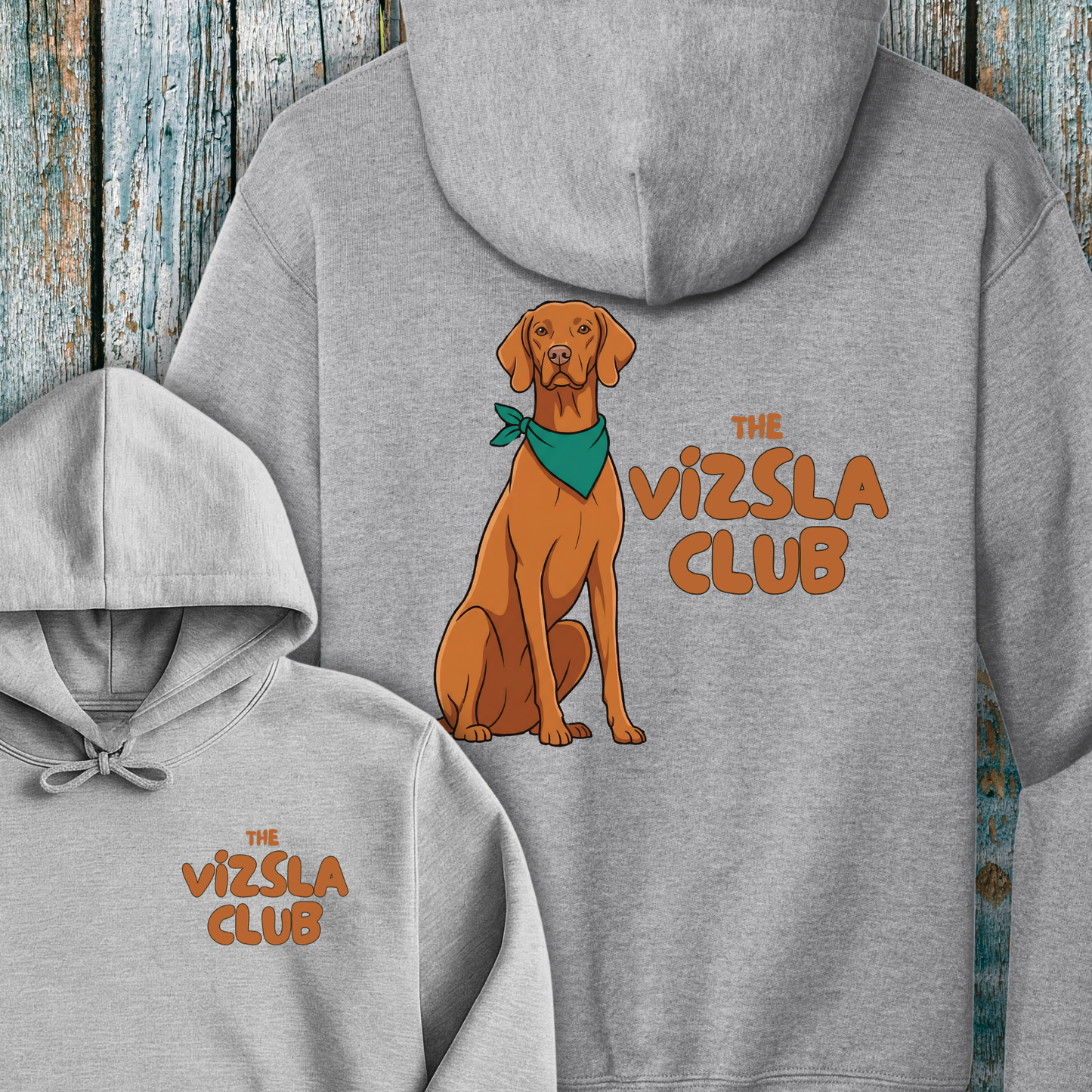 Gray hoodie with a Vizsla dog illustration and 'The Vizsla Club' text on a wooden background