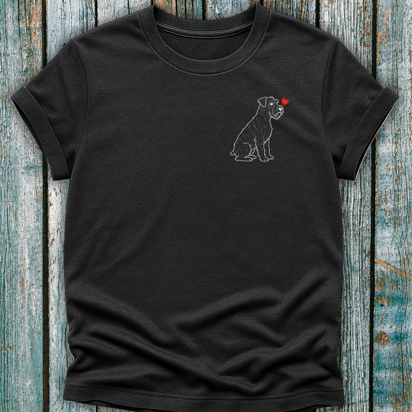 Dark Gray  t-shirt with a Schnauzer dog and heart design on a wooden surface