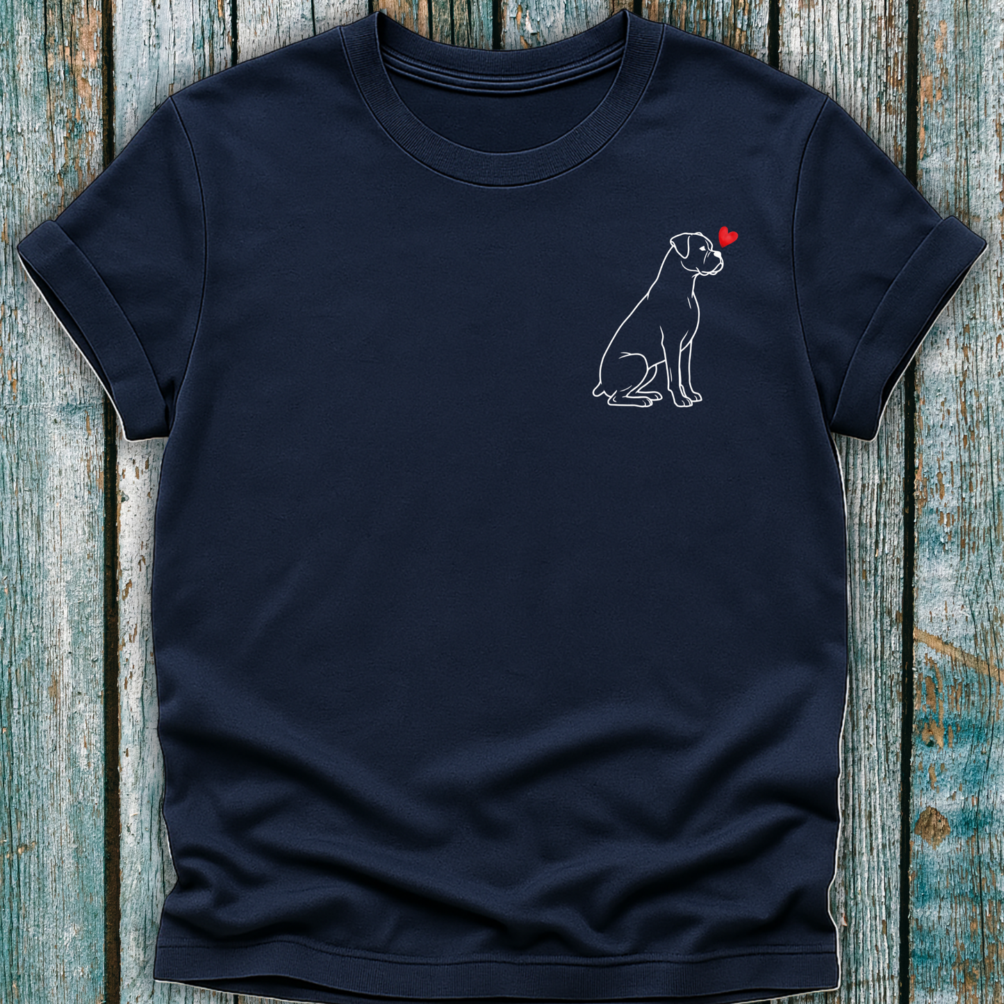 Navy blue t-shirt with a Boxer dog graphic and red heart on a wooden surface