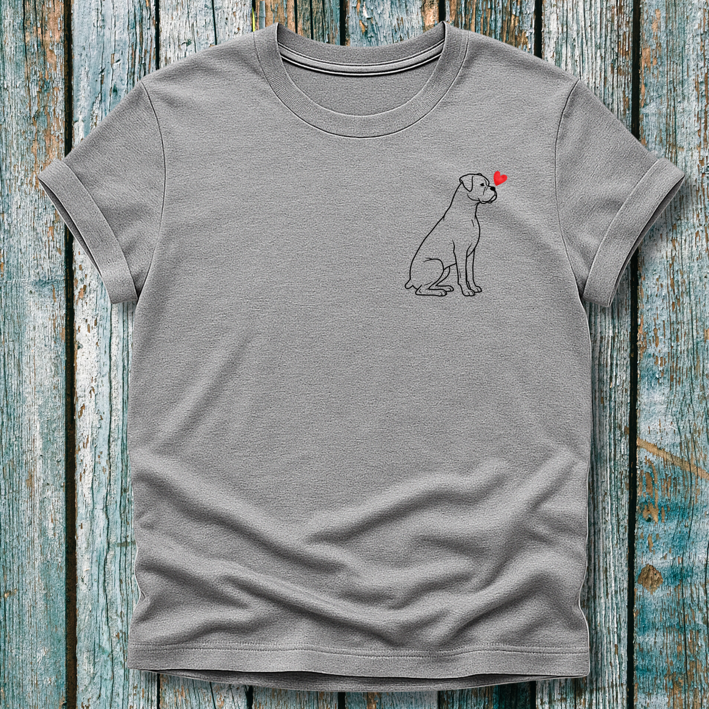 Gray t-shirt with a Boxer dog graphic and red heart on a wooden surface