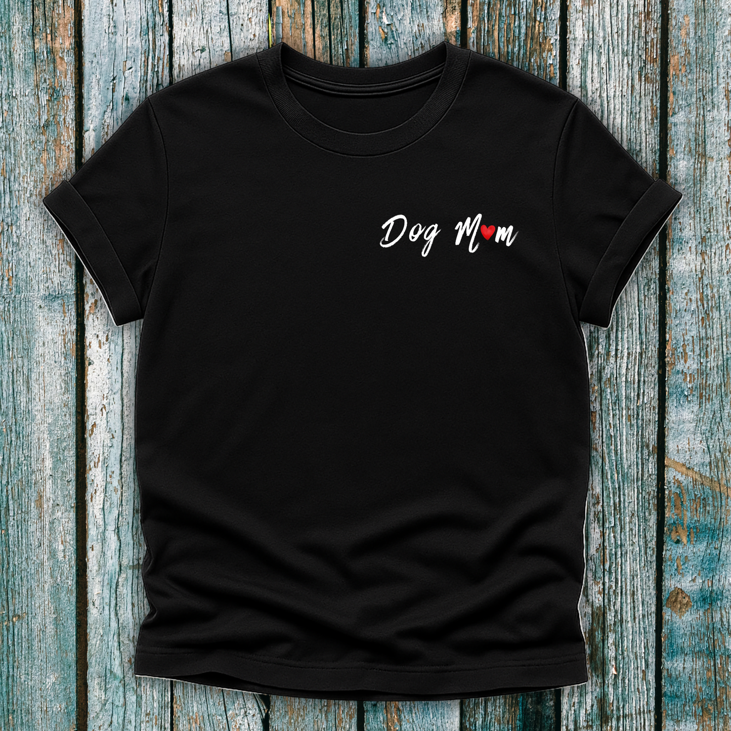 Black t-shirt with 'Dog Mom' 'Dog Mum' text on a wooden surface
