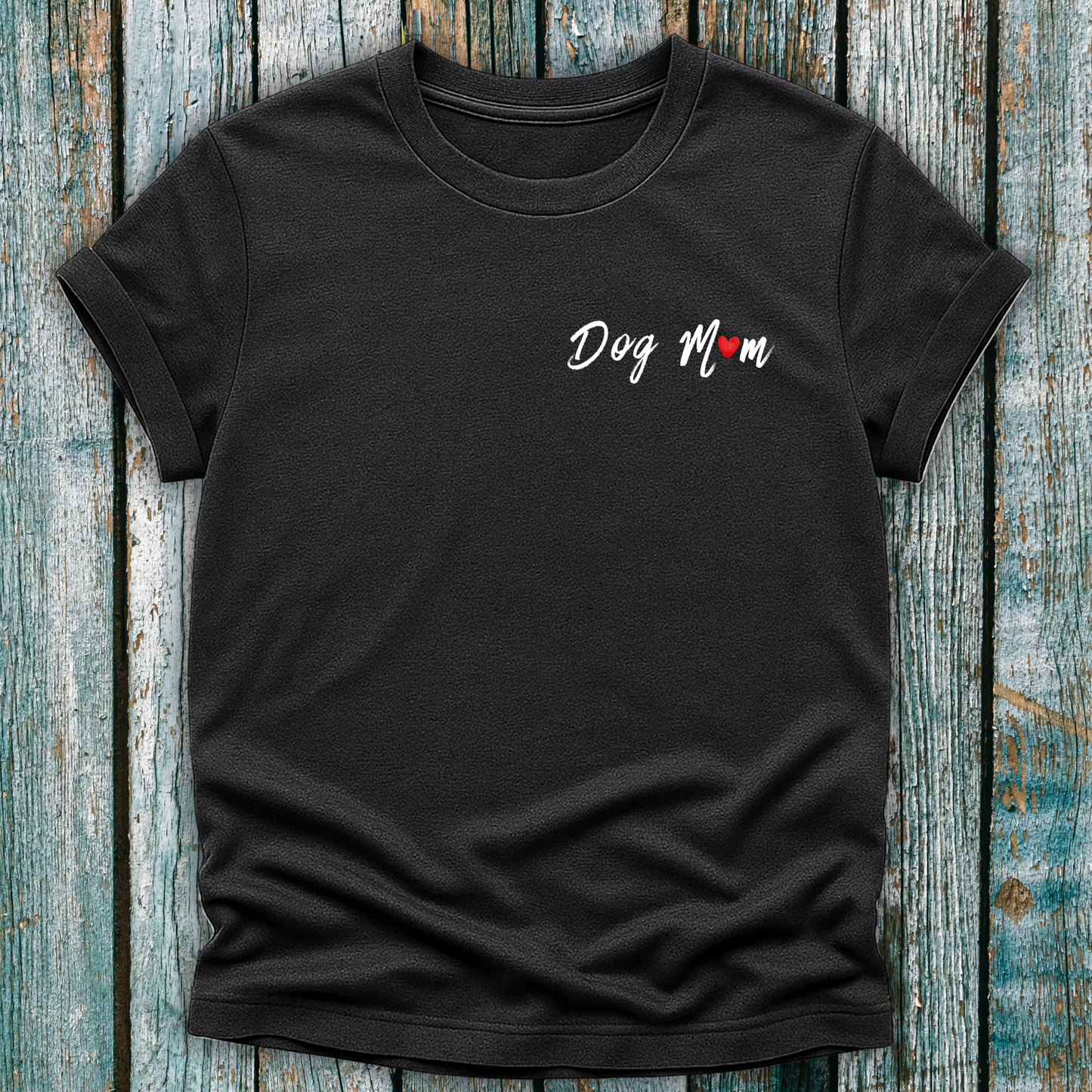 Black t-shirt with 'Dog Mom' 'Dog Mum' text on a wooden surface
