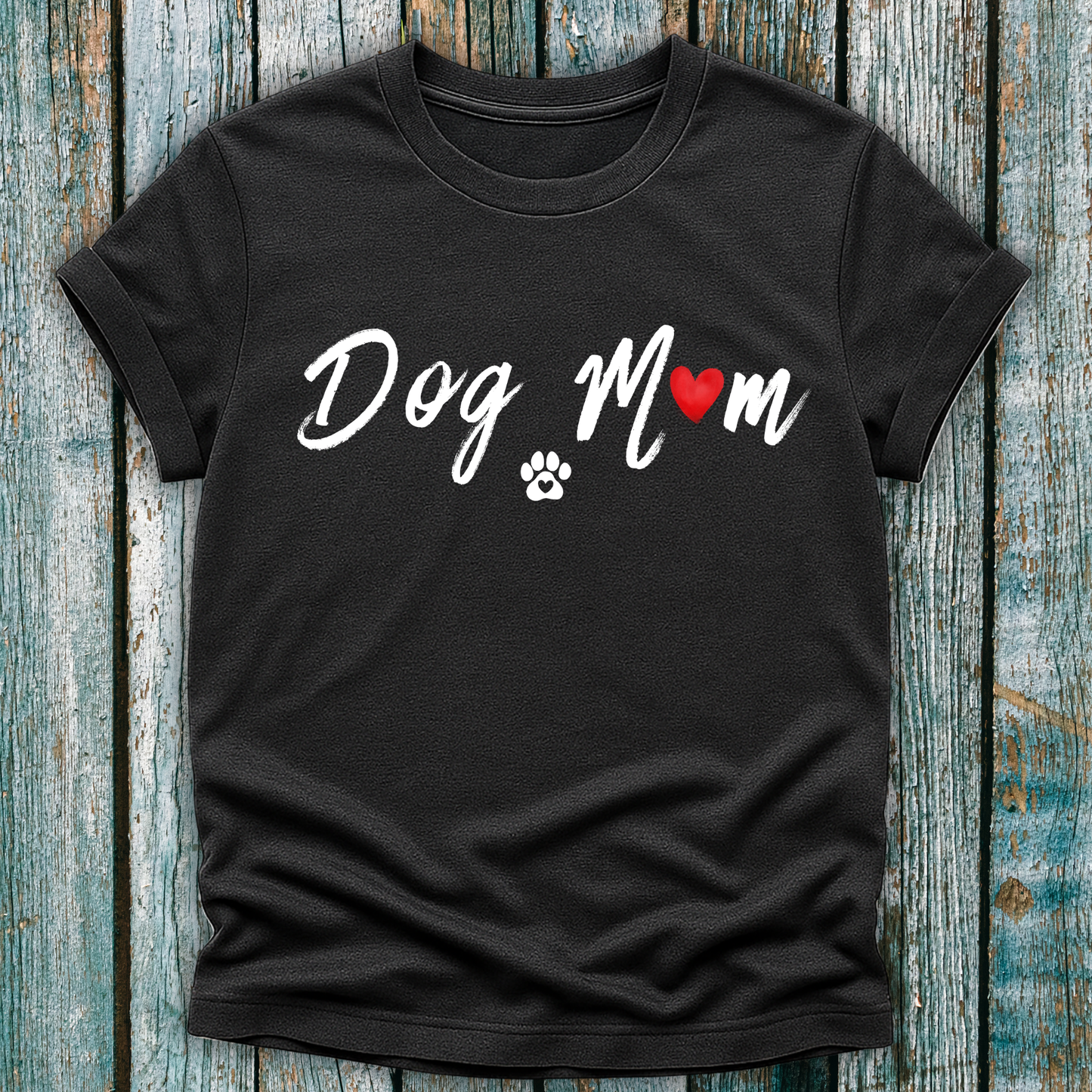 Dark Gray t-shirt with 'Dog Mom' 'Dog Mum' text and heart and paw graphic on a wooden surface