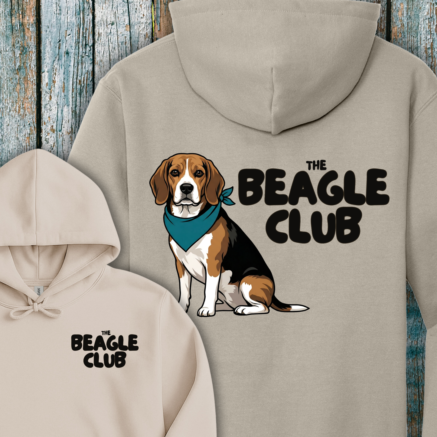 Beige hoodie with a beagle graphic and 'The Beagle Club' text on a wooden background