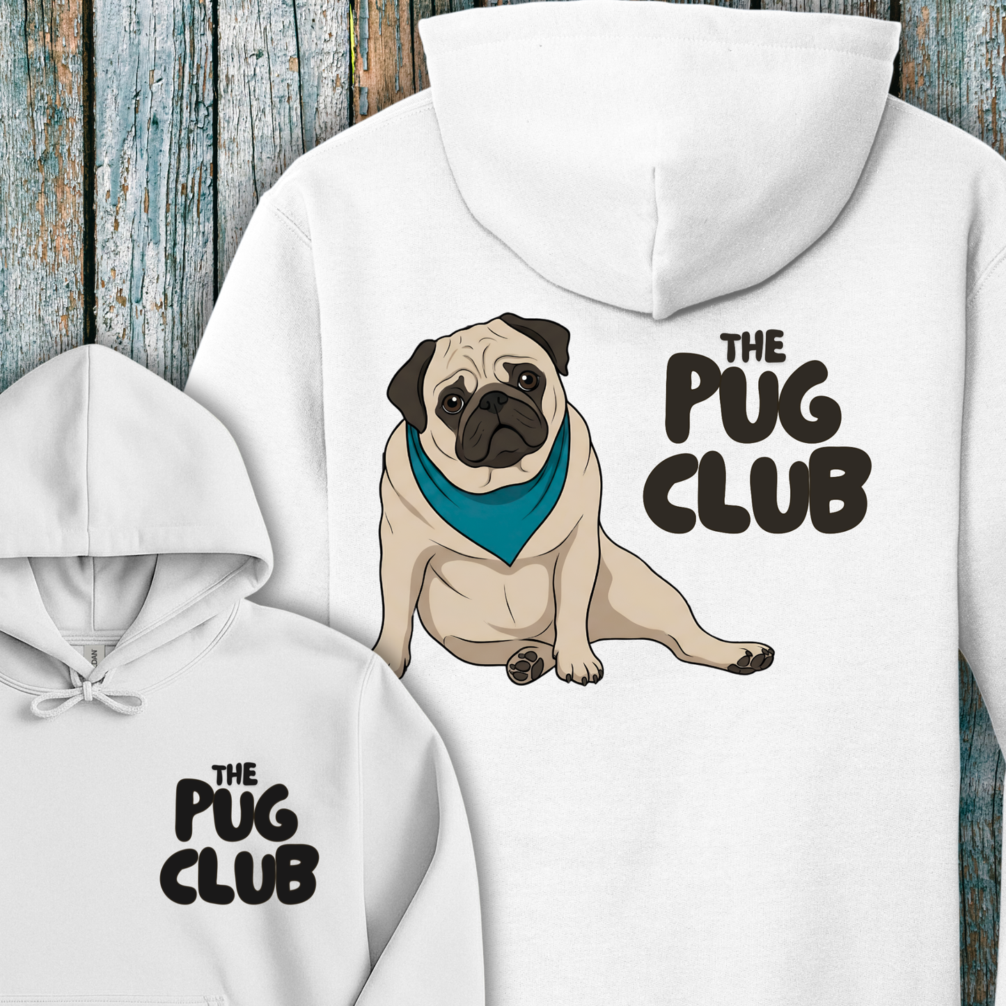 White hoodie with a pug illustration and 'The Pug Club' text on a wooden background