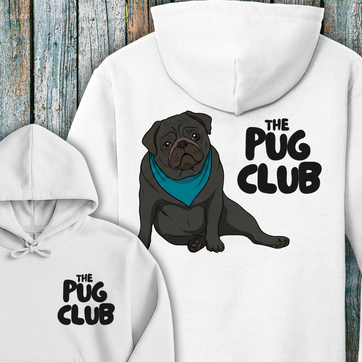 White hoodie with a pug illustration and 'The Pug Club' text on a wooden background