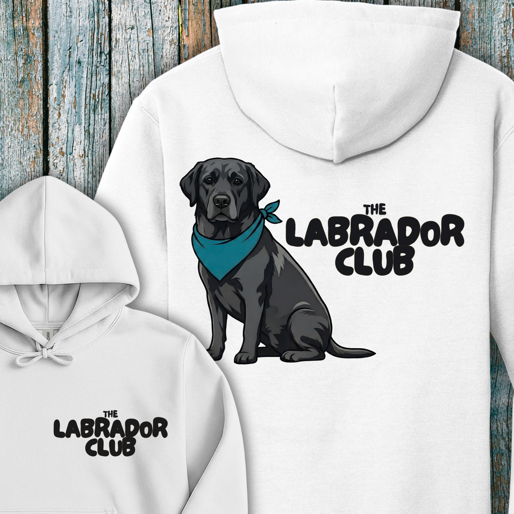 White hoodie with a black labrador and 'The Labrador Club' text on a wooden background