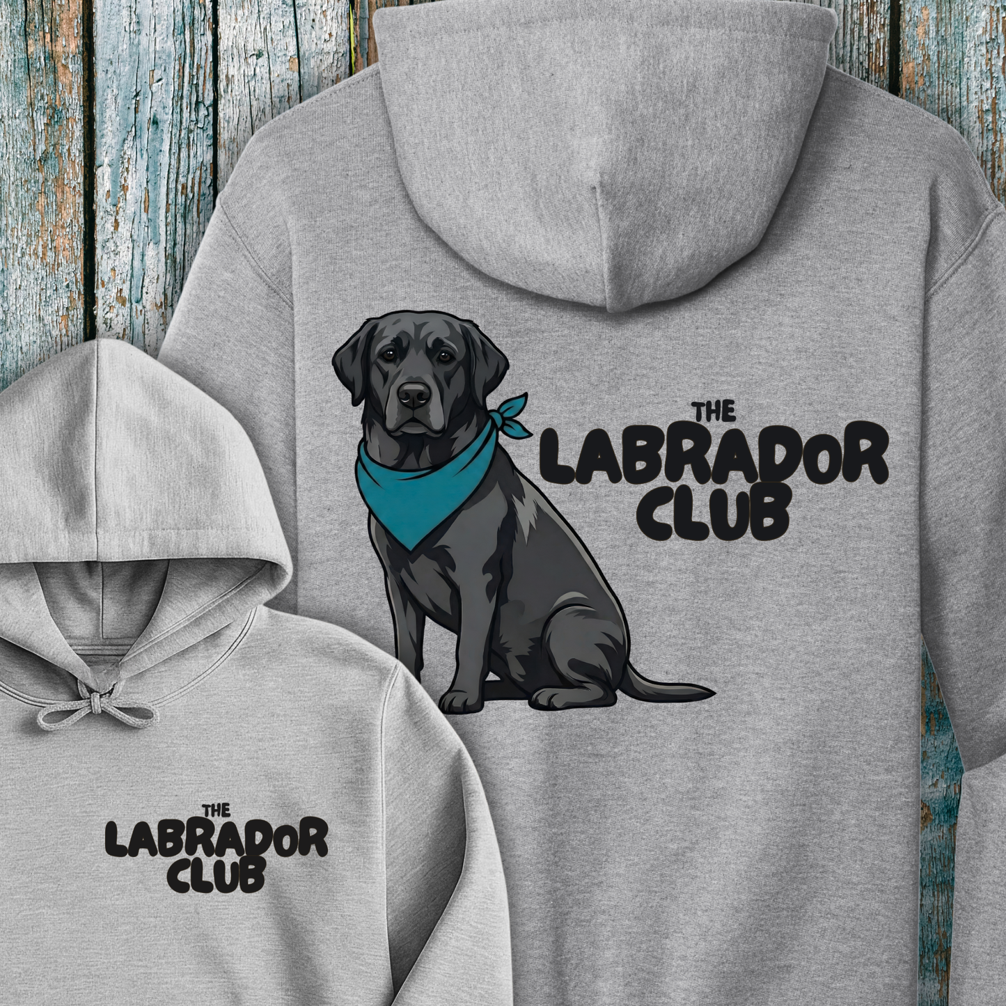 Gray hoodie with a black Labrador and 'The Labrador Club' text on a wooden background