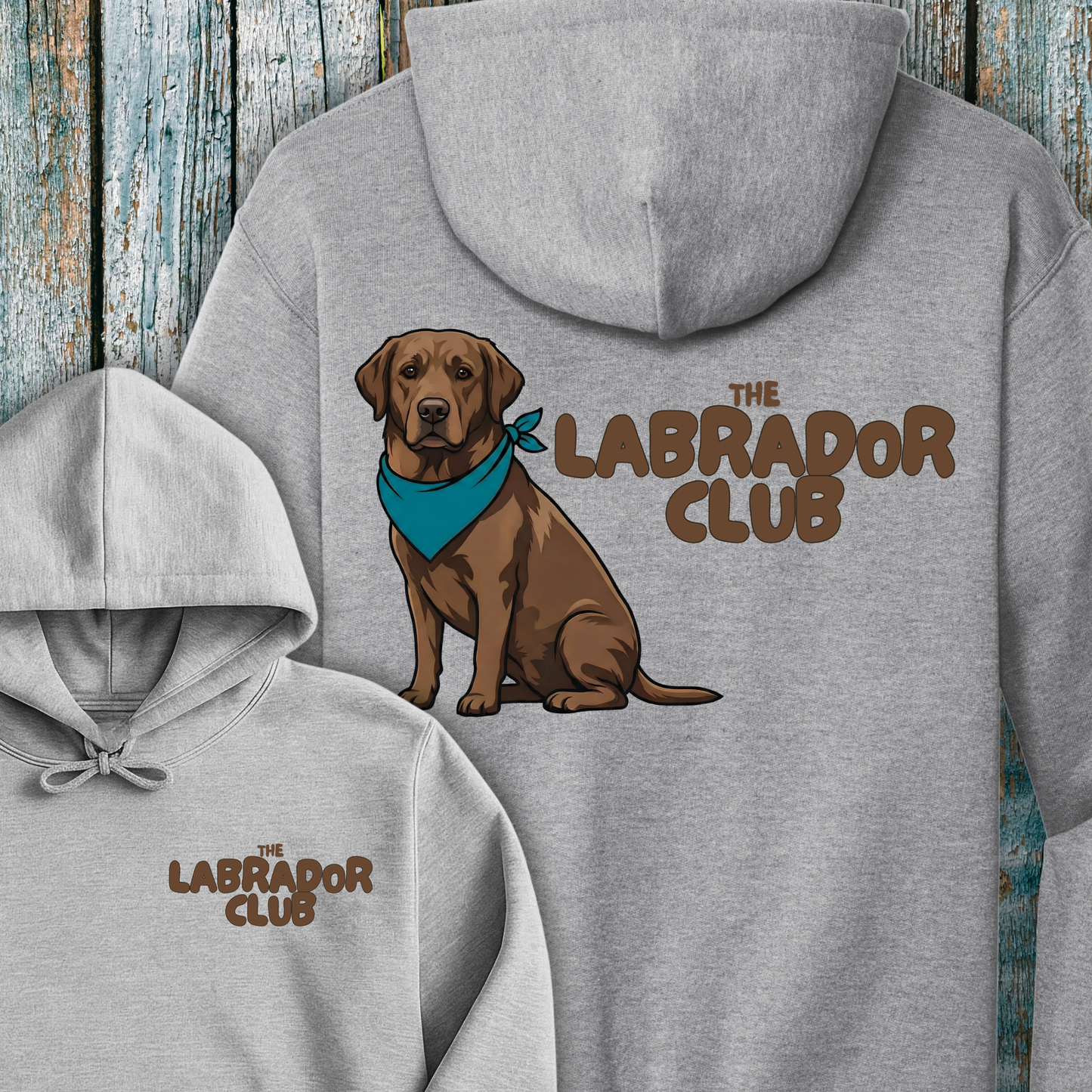 Gray hoodie with a chocolate Labrador and 'The Labrador Club' text on a wooden background