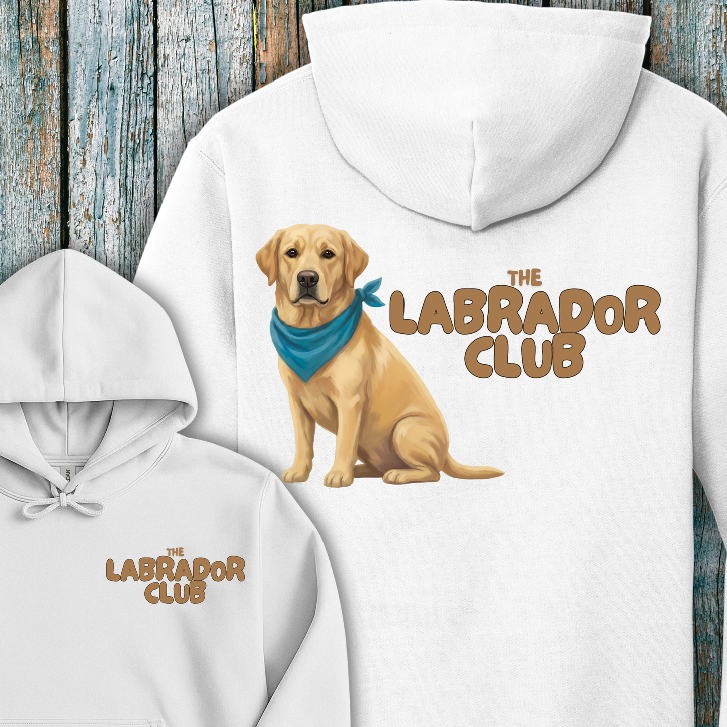 White hoodie with a Golden Labrador retriever graphic and 'The Labrador Club' text on a wooden background