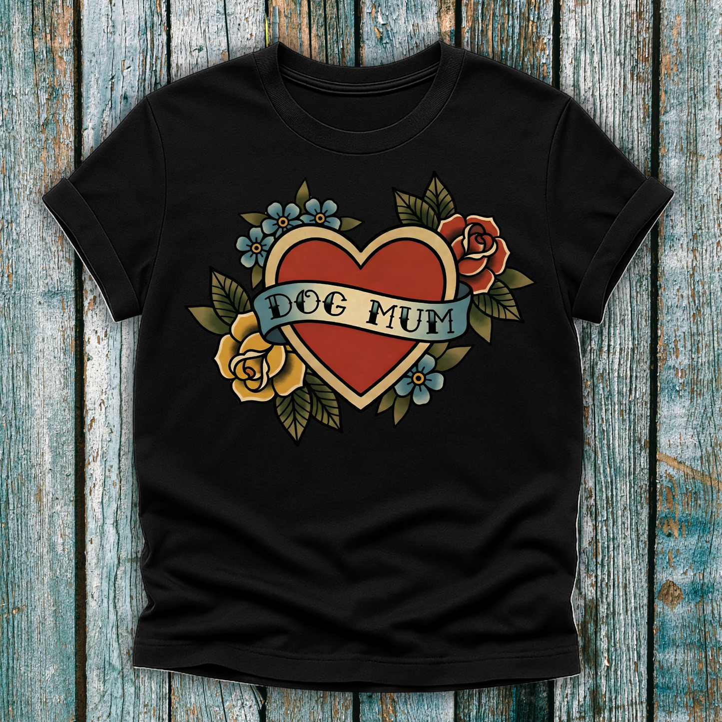 Black t-shirt with a heart design and 'DOG MUM' text on a wooden surface