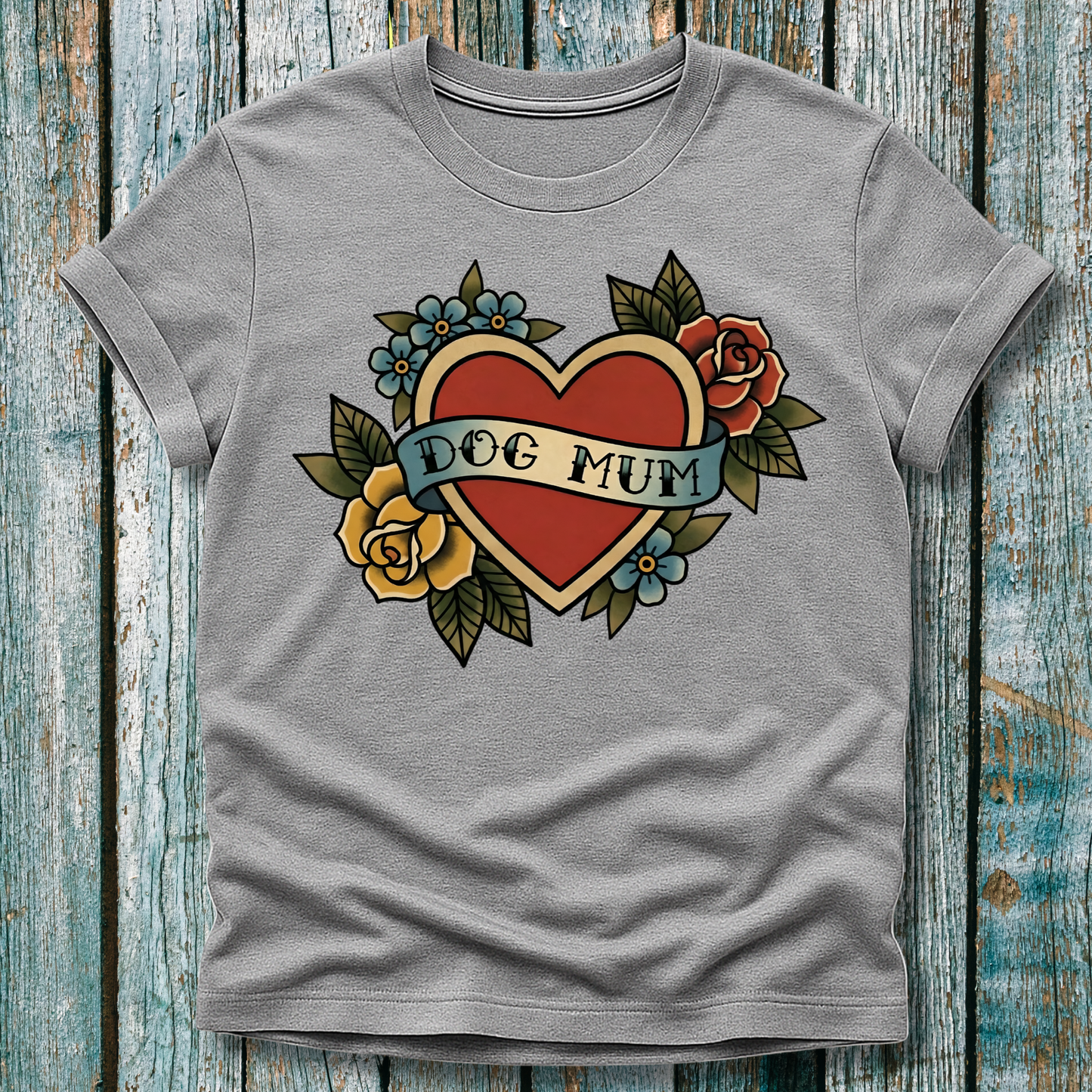 Gray t-shirt with a heart design and 'DOG MUM' text on a wooden surface