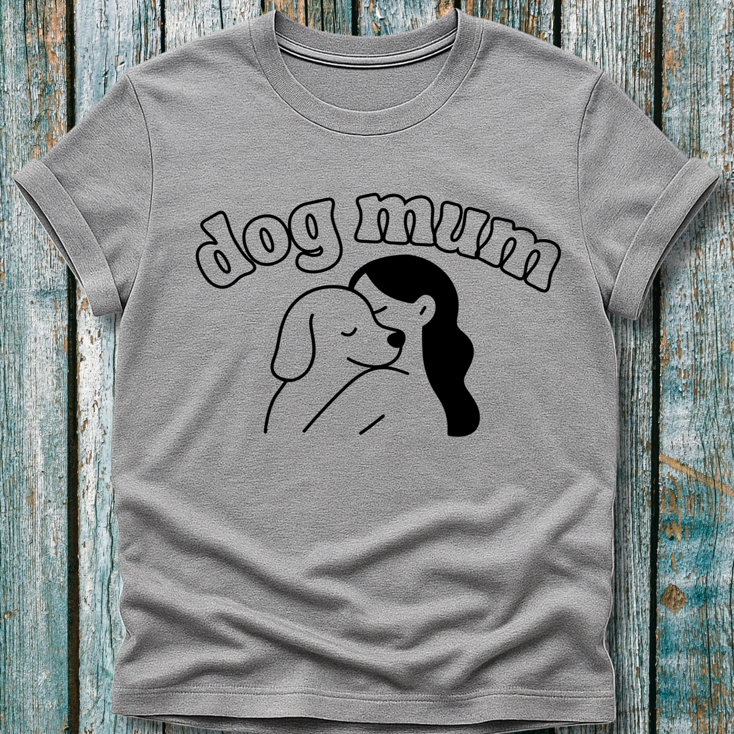 Gray t-shirt with 'dog mum' text and graphic on a wooden surface