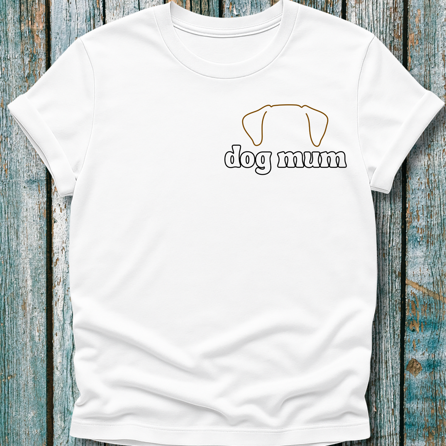White t-shirt with 'dog mum' text and dog icon on a wooden surface
