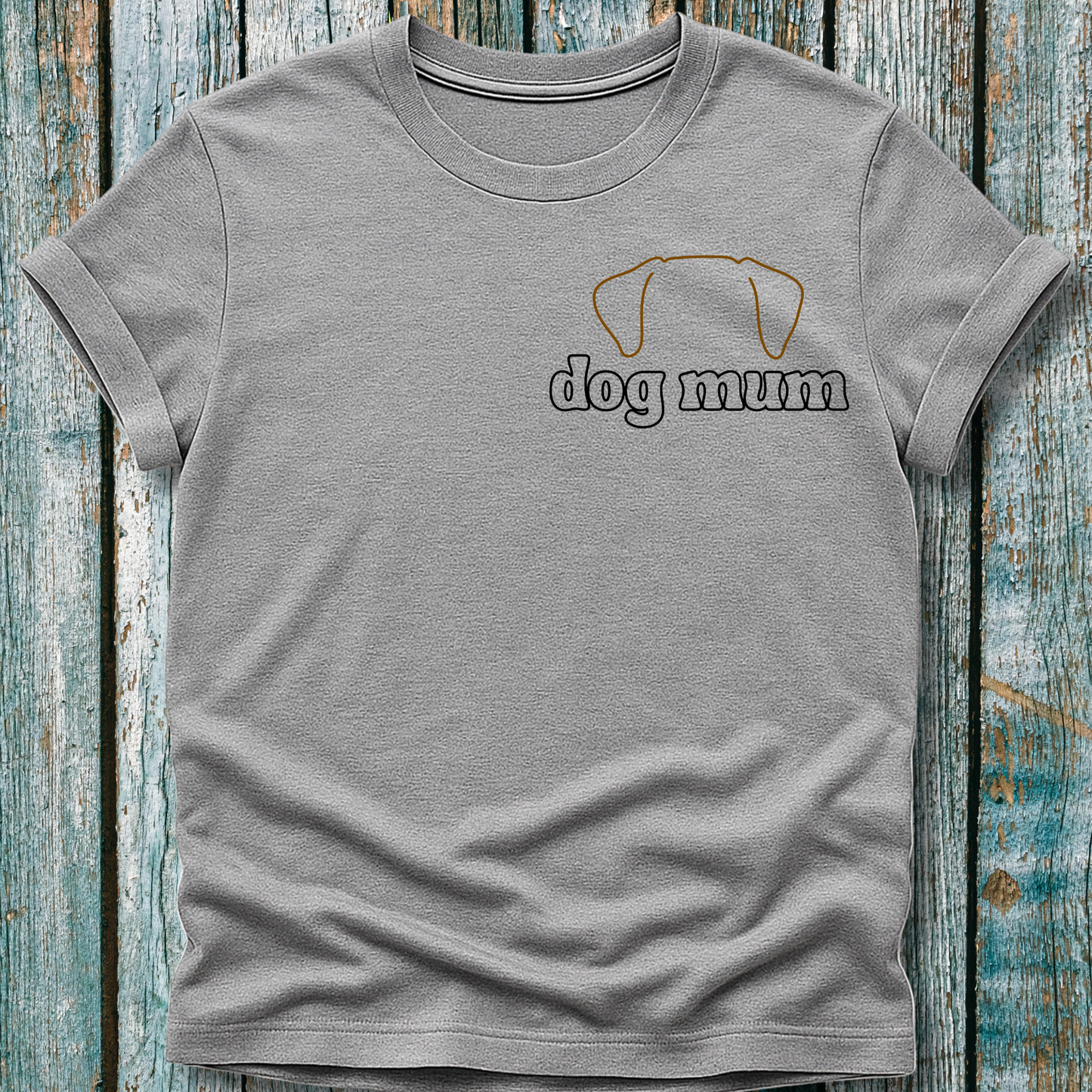 Gray t-shirt with 'dog mum' text and dog icon on a wooden surface