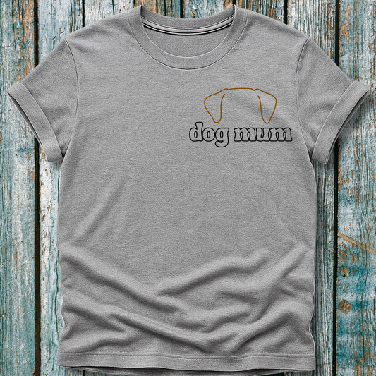 Gray t-shirt with 'dog mum' text and dog icon on a wooden surface