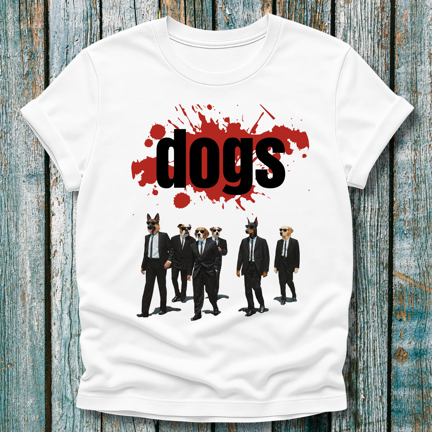 White t-shirt with graphic design of dogs in suits and 'dogs' text on a wooden surface