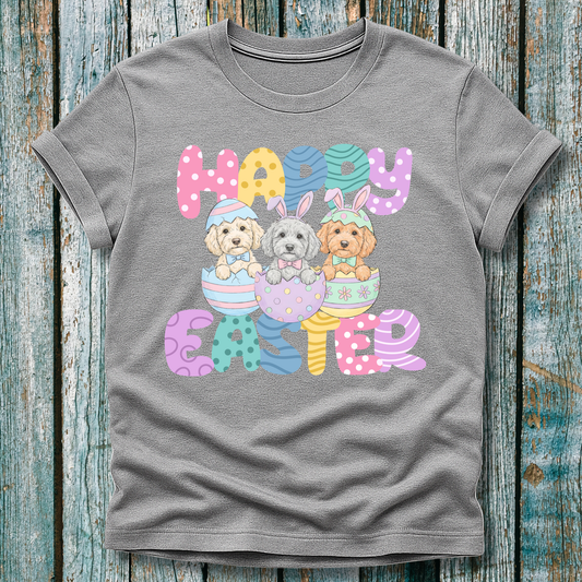 Gray t-shirt with 'Happy Easter' text and cartoon doodle puppies on a wooden background