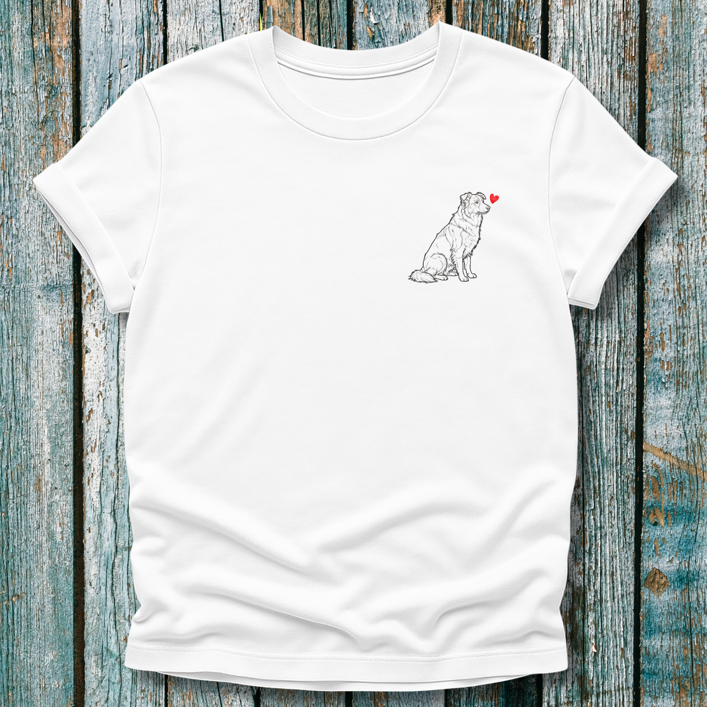 White  t-shirt with a Greyhound dog graphic and a red heart on a wooden surface