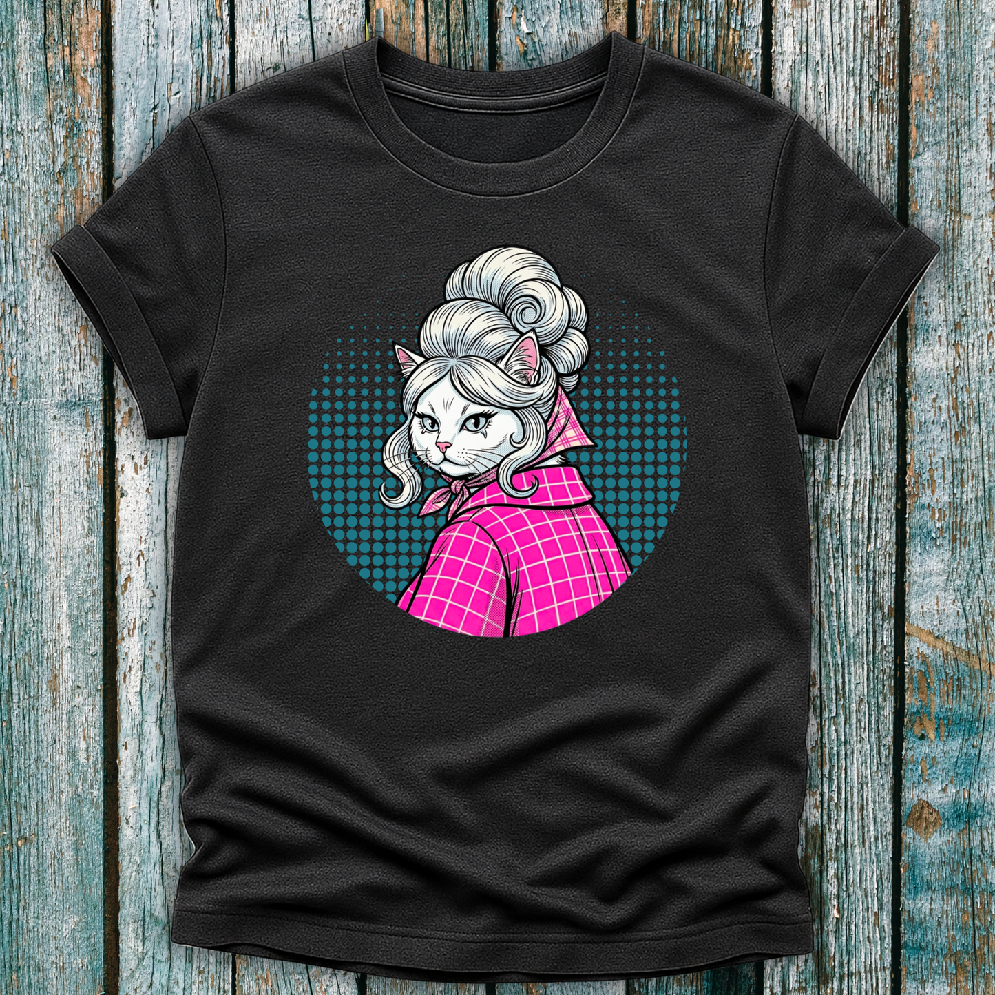 Dark Gray  t-shirt with a colorful graphic of a pop art cat character in a pink outfit on a wooden surface
