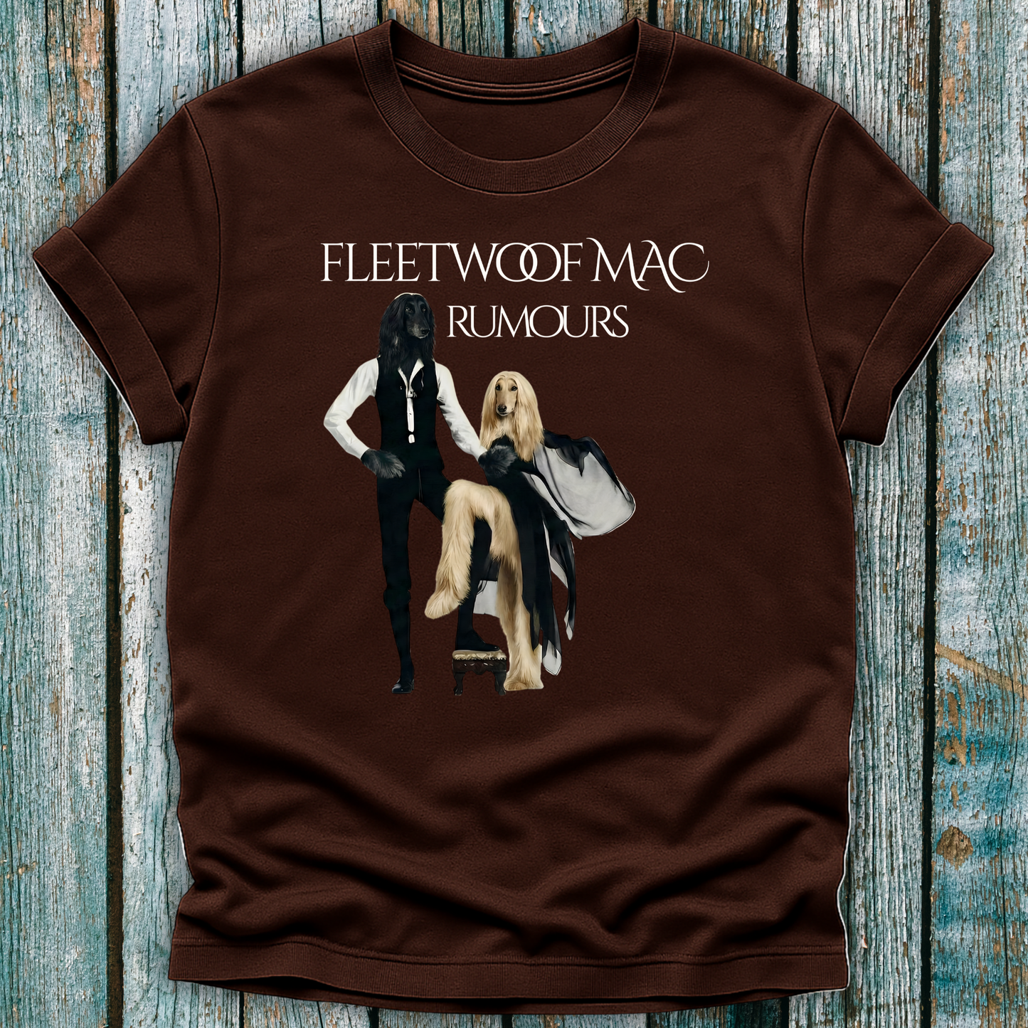 Brown t-shirt with Fleetwoof Mac 'Rumours' design on a wooden surface