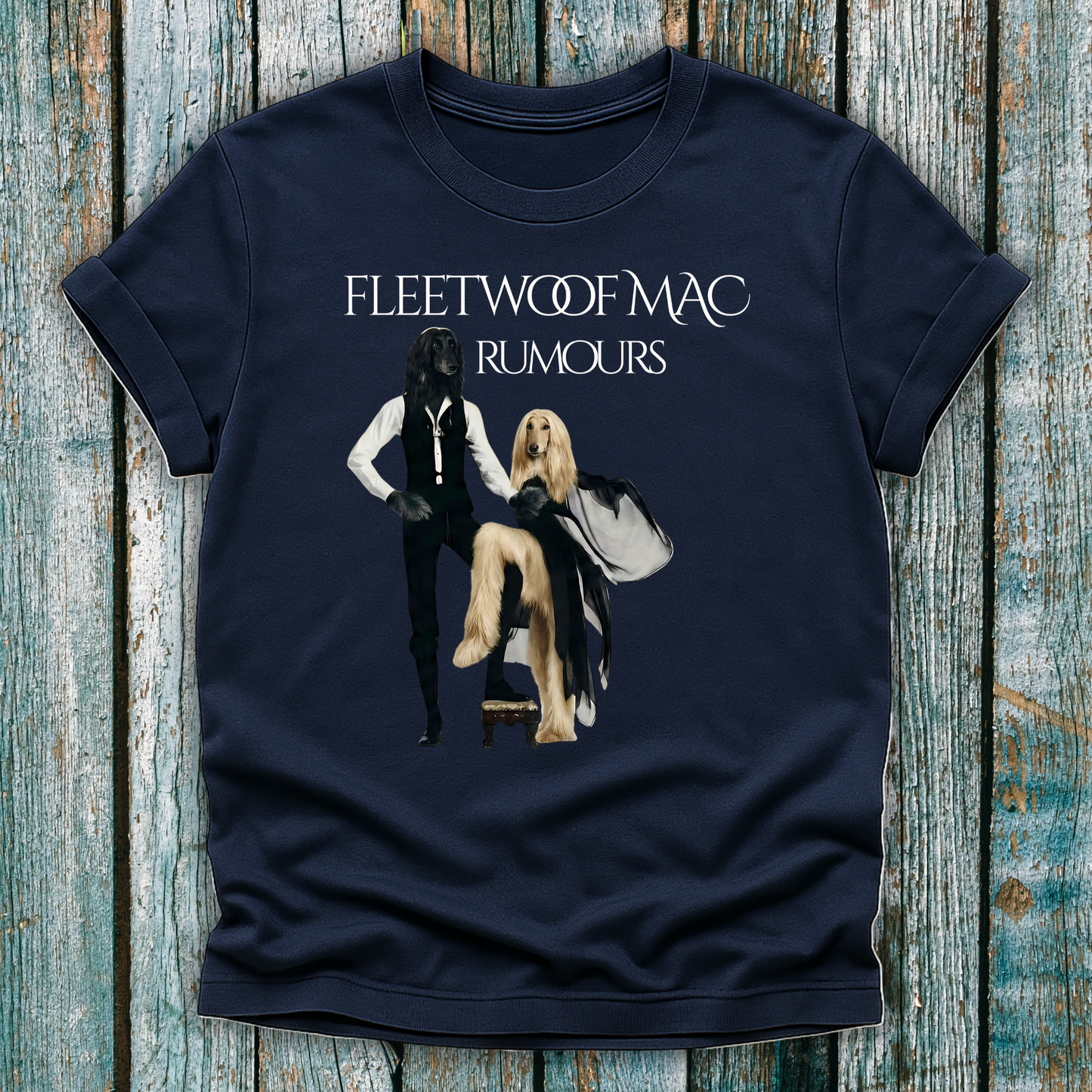 Navy blue t-shirt with Fleetwoof Mac 'Rumours' design on a wooden surface