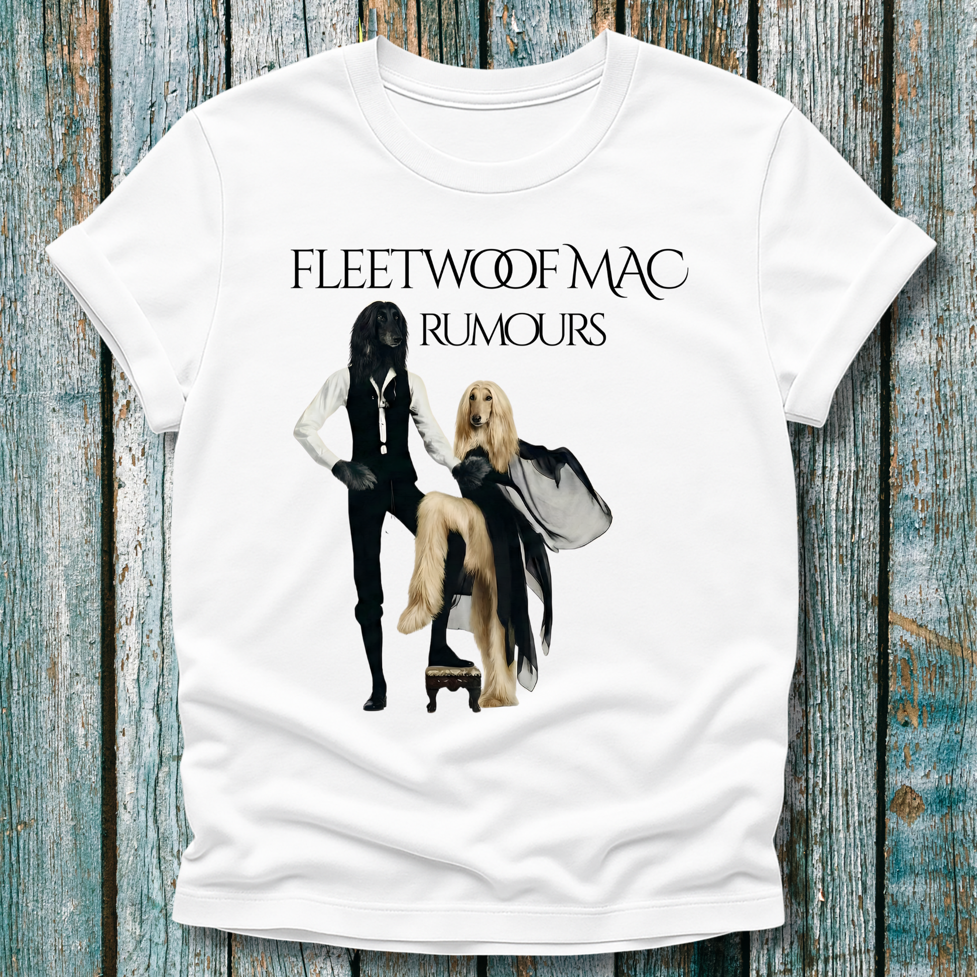 White t-shirt with Fleetwoof Mac 'Rumours' album cover design on a wooden background