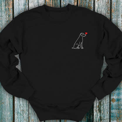 Black sweatshirt with a Labrador dog and heart design on a wooden surface